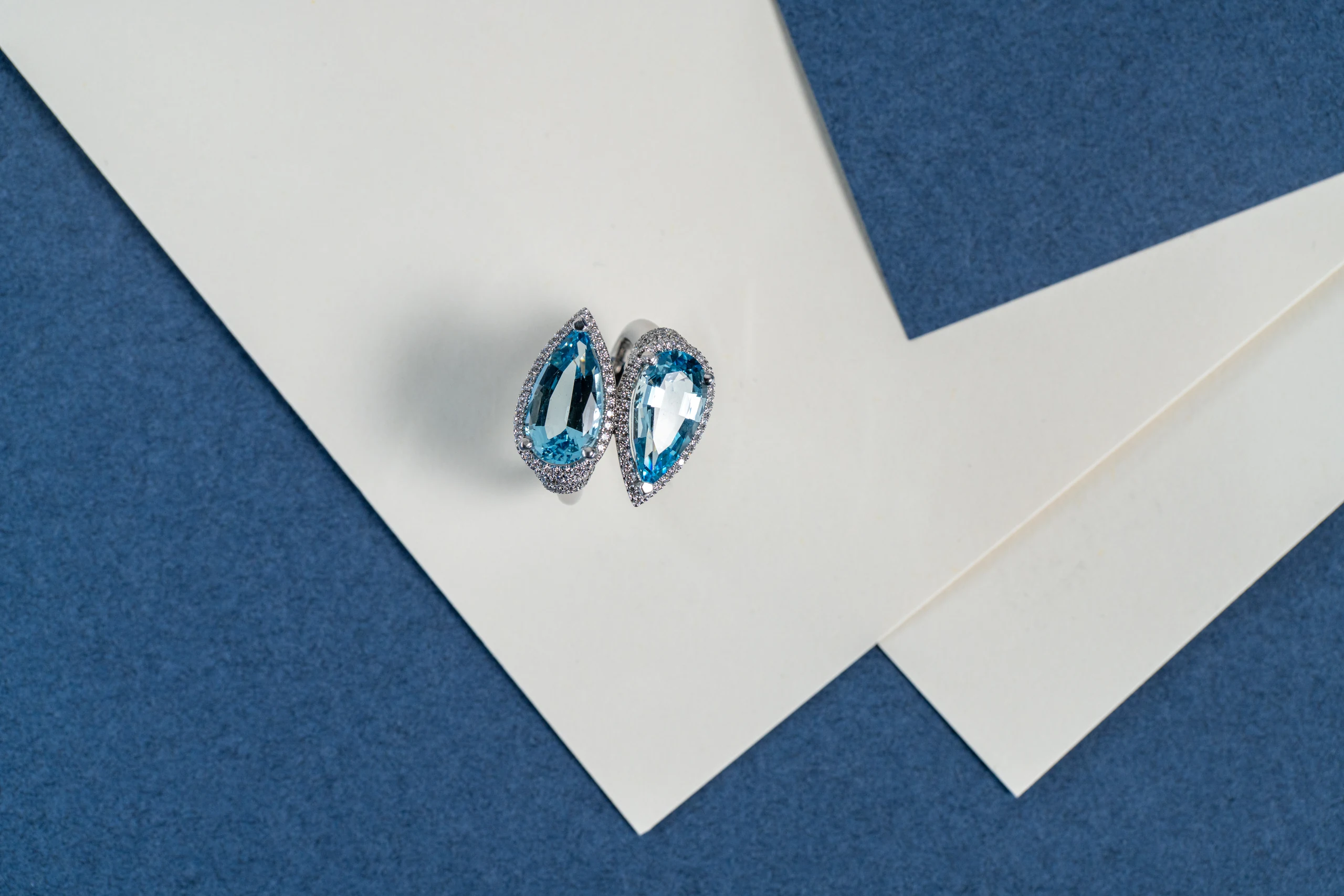 Toi et Moi ring, two aquamarines on light and blue paper
