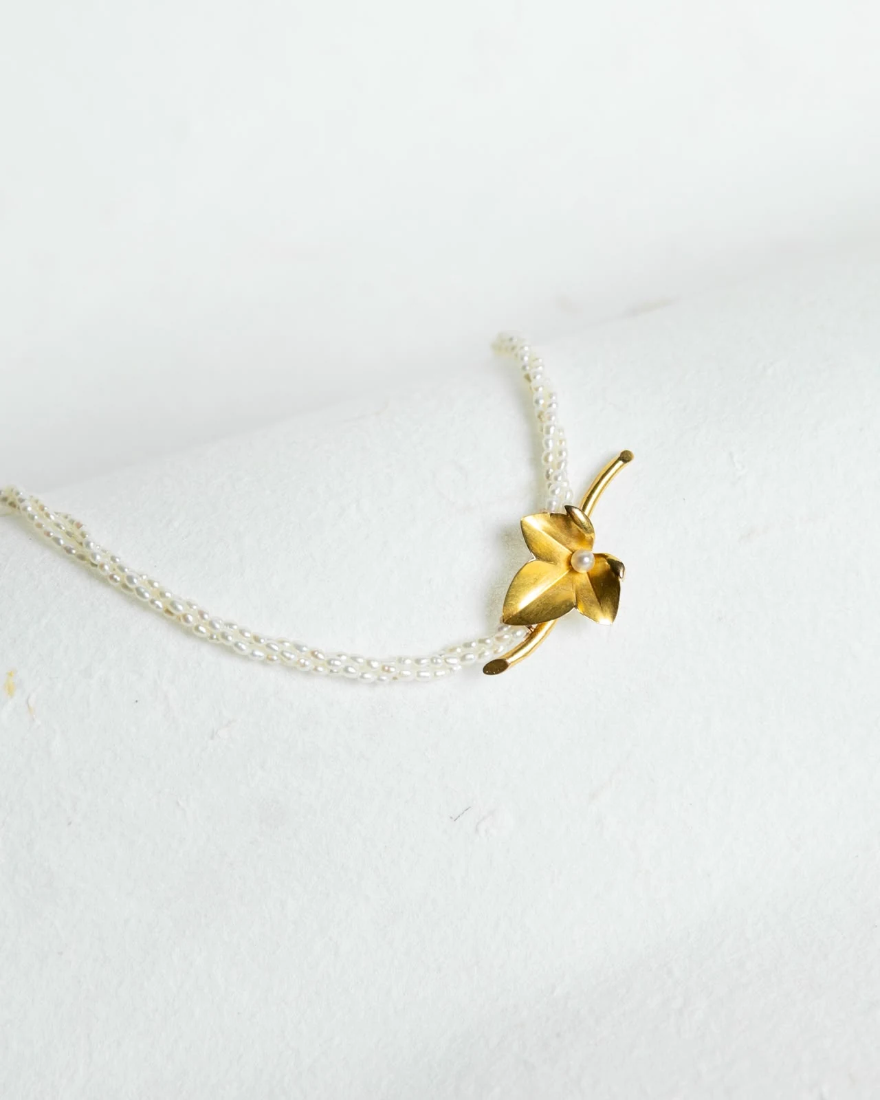 The delicate necklace created from the brooch